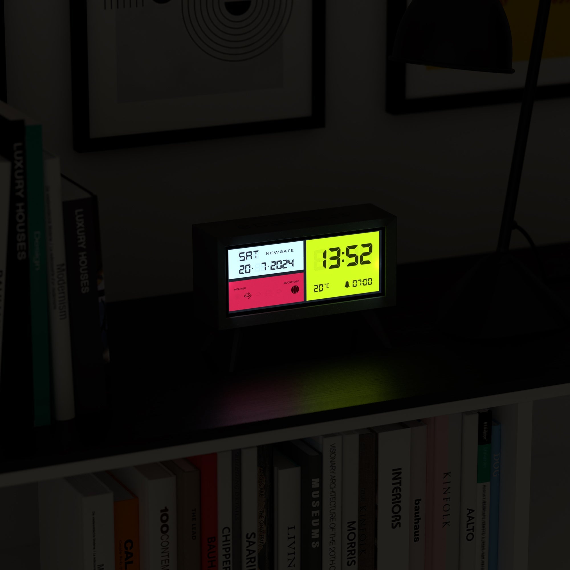 Matte black LCD alarm clock with green 13:52 display and red control section