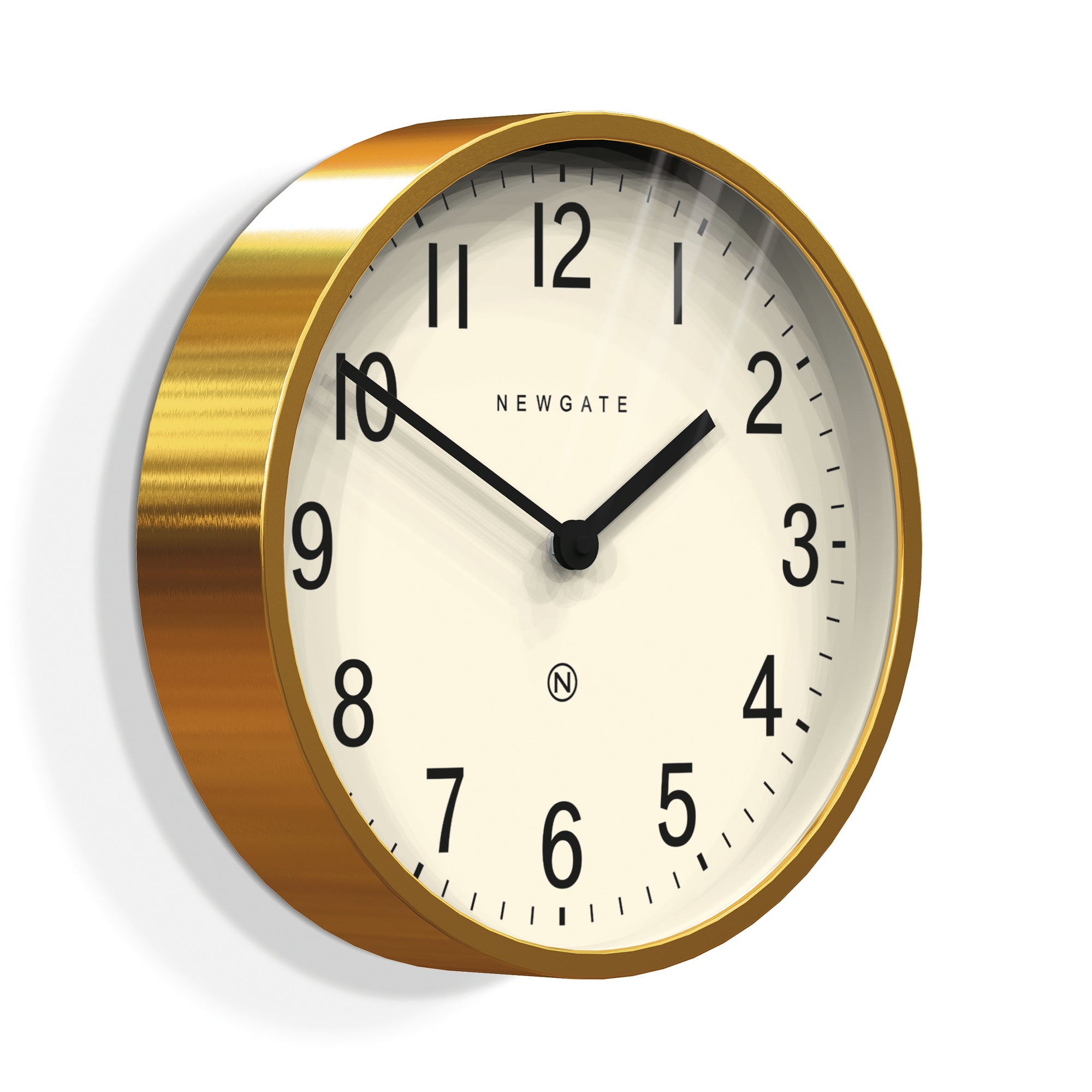 Round brass wall clock face close-up with cream dial, black numerals and hands