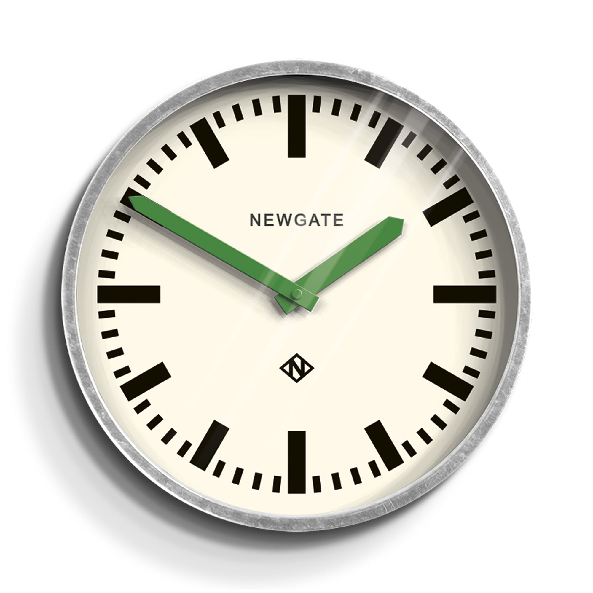 Wall clock with cream dial, black hour markers, and green hands