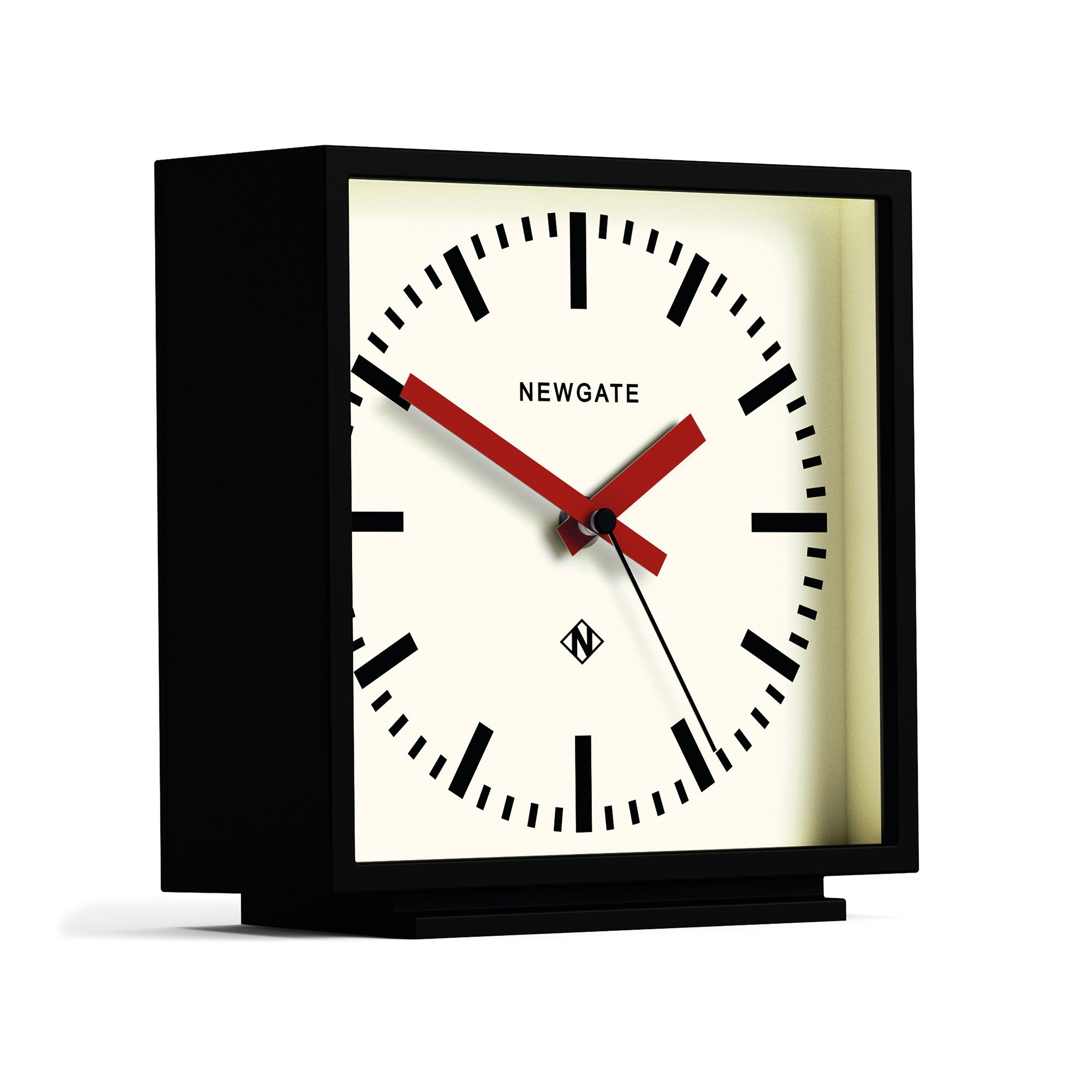 Black mantel clock with red hands, cream dial, and visible side profile