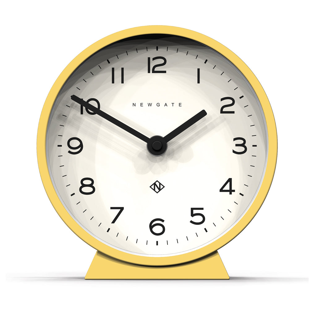 Yellow mantel clock with white dial, black numerals and hands