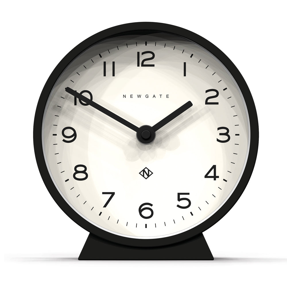 Black mantel clock with round bezel, cream dial, and standing base.