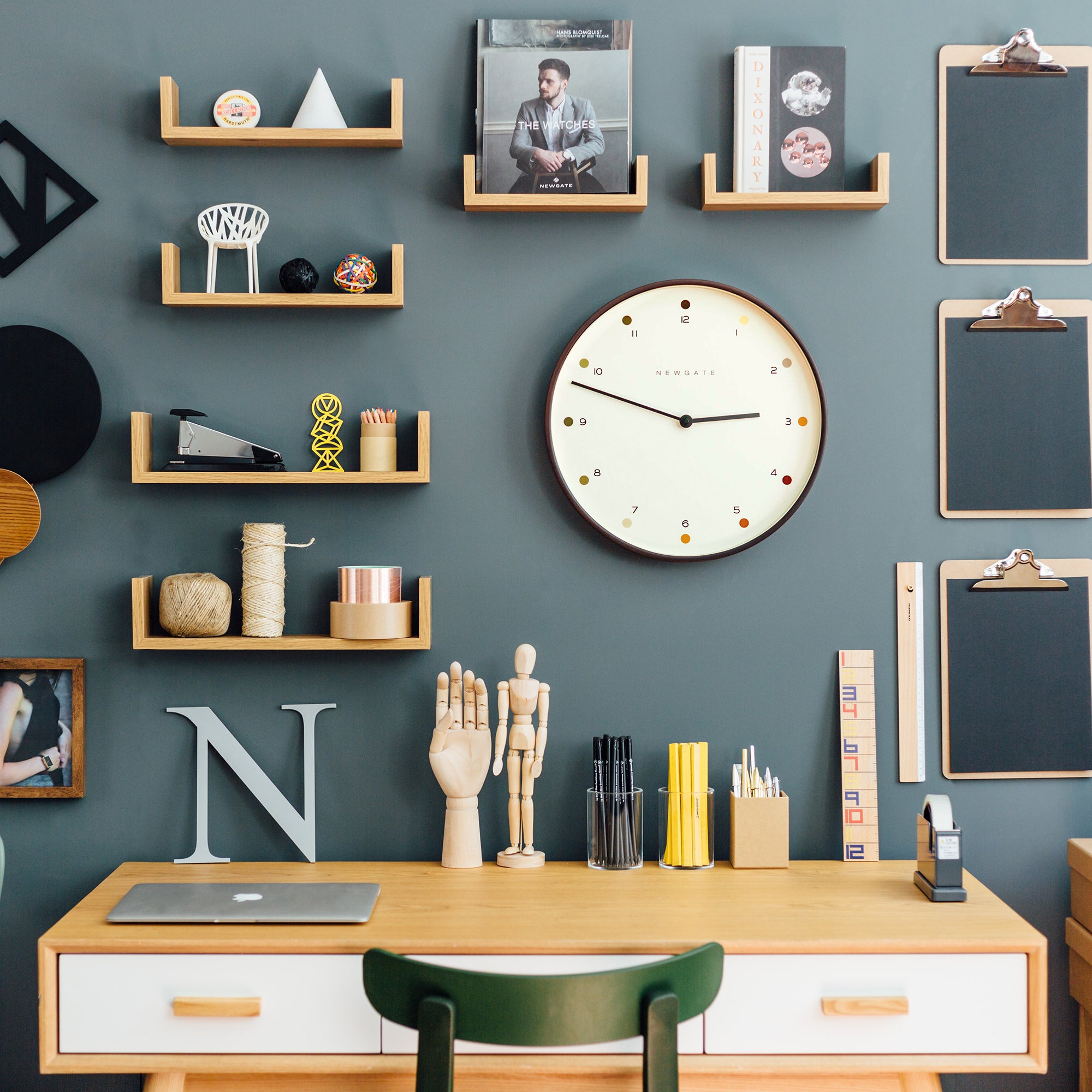 Round wall clock with cream dot dial and dark wooden rim on a wall