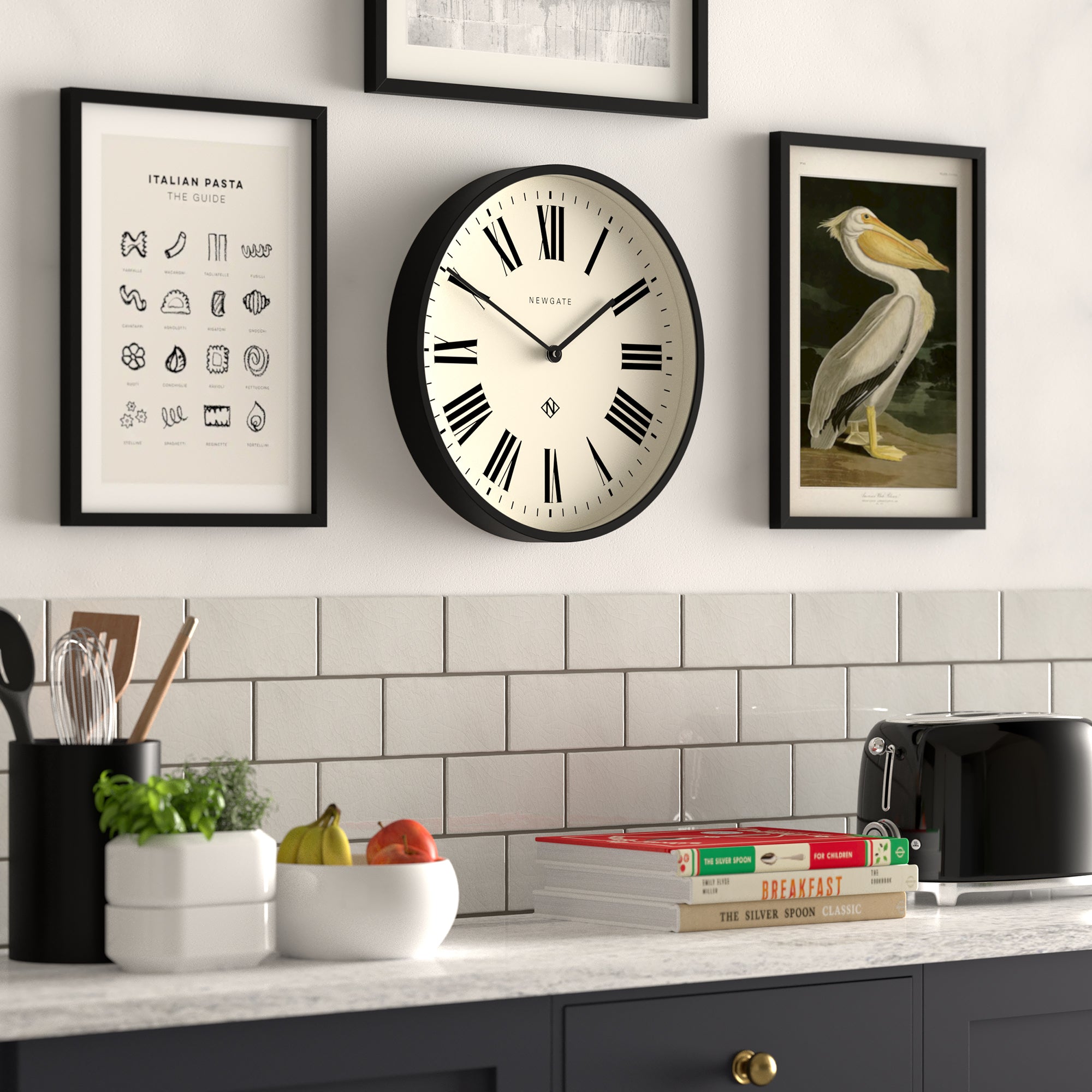 Black-framed wall clock with cream dial, Roman numerals and black hour markers