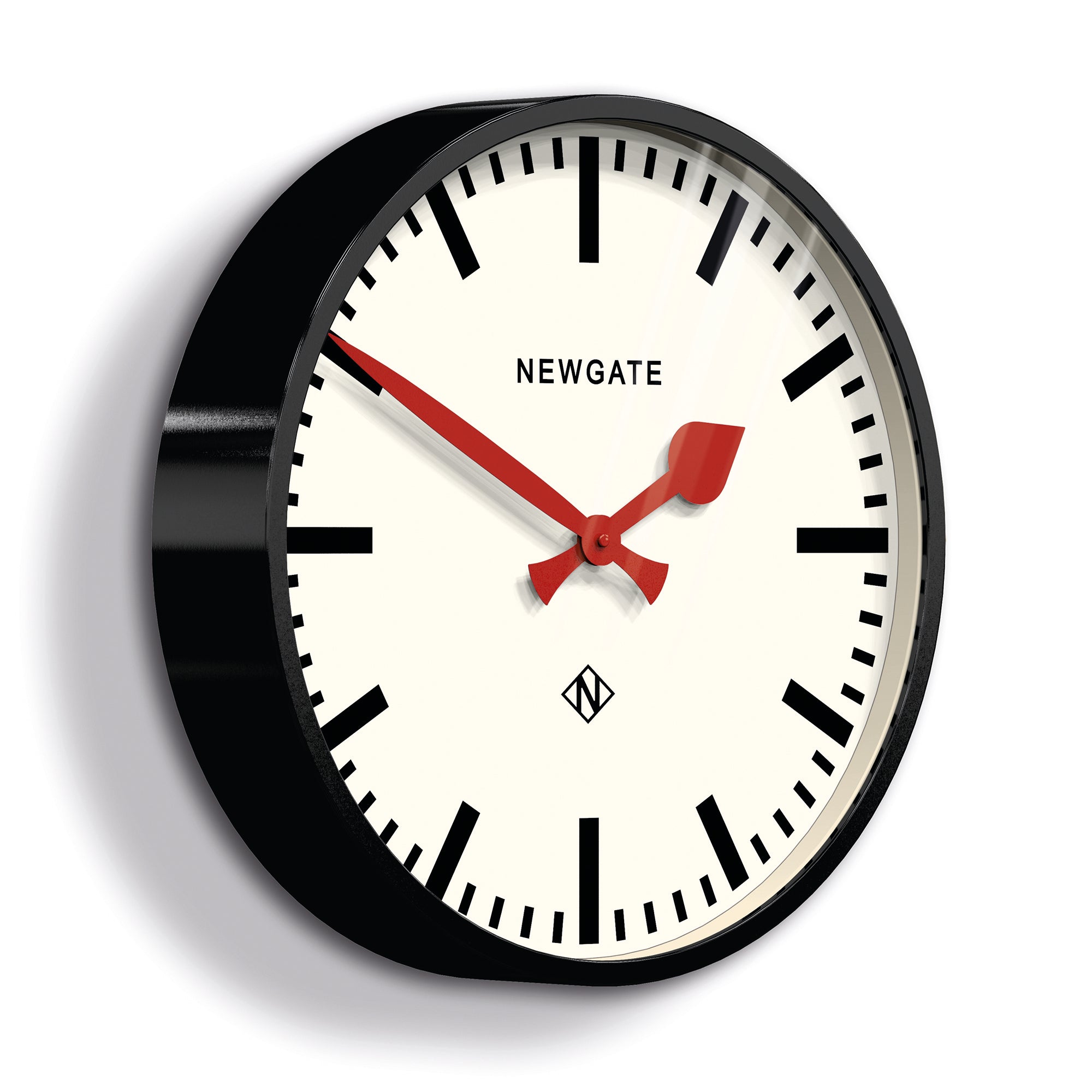 Black wall clock close-up showing red hands and white dial with Newgate text.