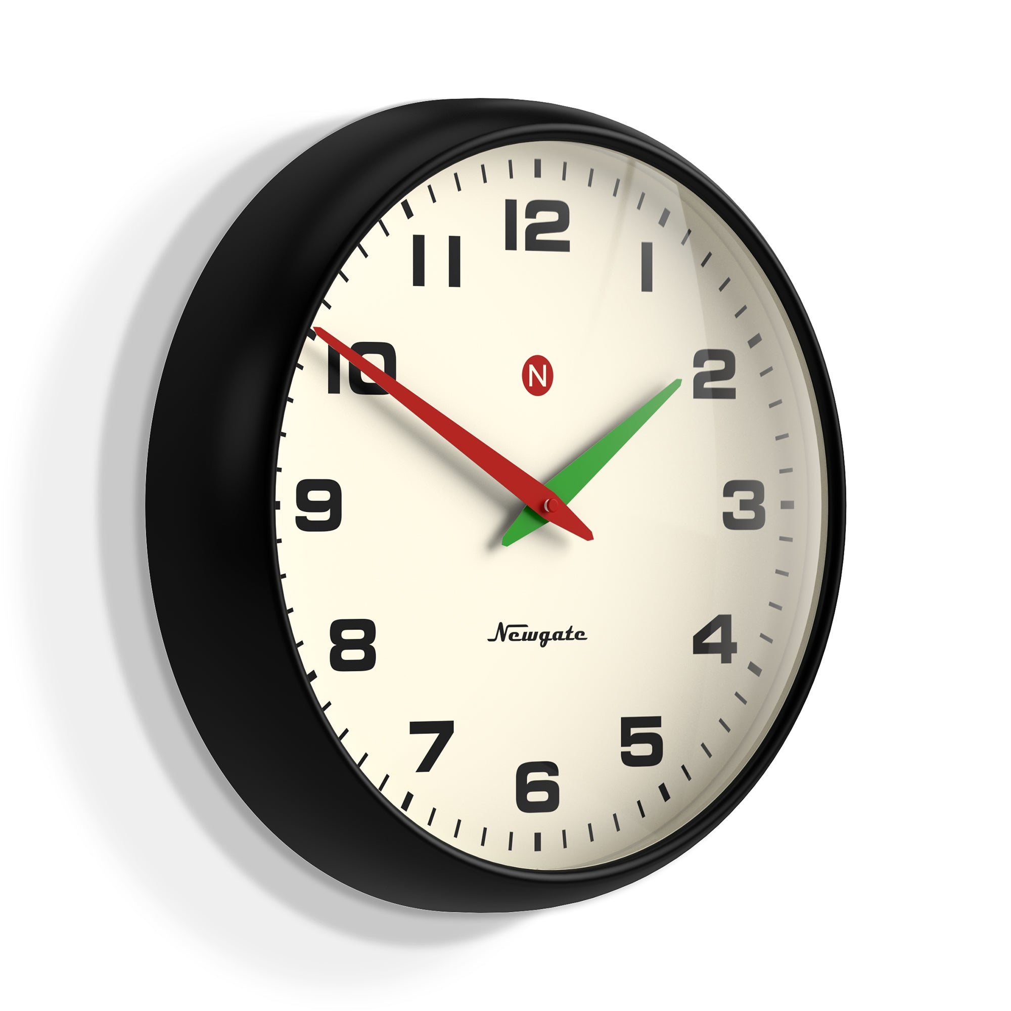 Black framed wall clock with cream face, red/green hands, bold numerals, and Newgate mark.