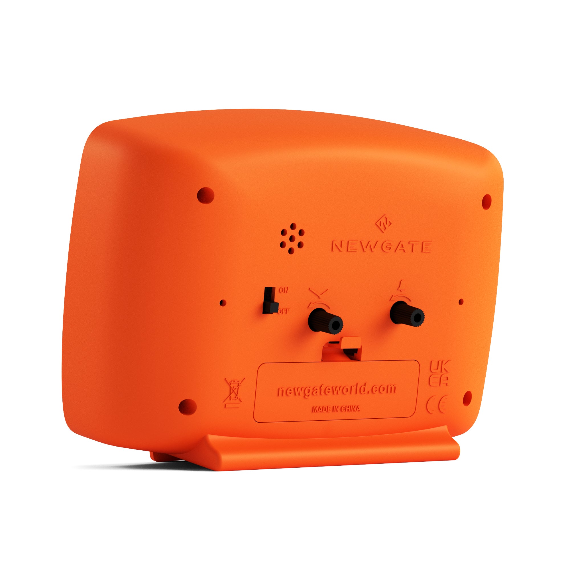 Orange alarm clock back panel with speaker grille and power input ports