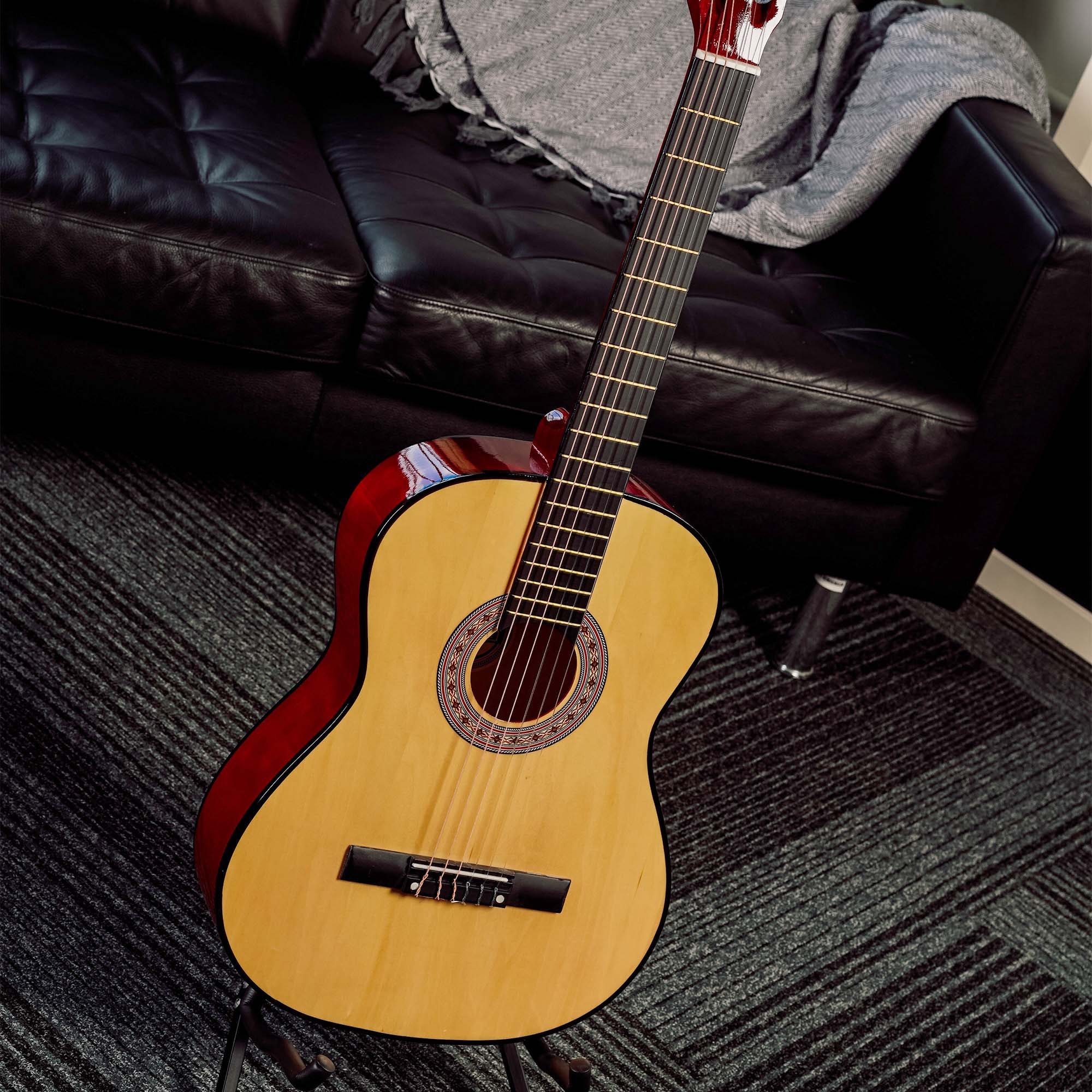 Natural classical guitar with red binding and decorative rosette sound hole
