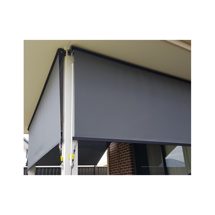 Mounted roller sun screen blind with gray mesh fabric and black housing
