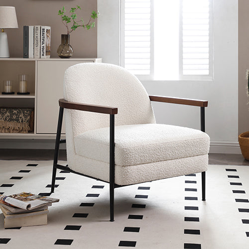 Upholstered armchair with cream polyester fabric, dark wood armrests, black metal legs