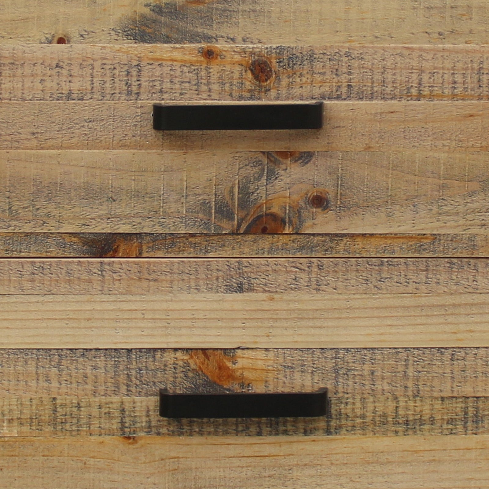 Close-up of antique light brown bedside table drawers with dark pull handles