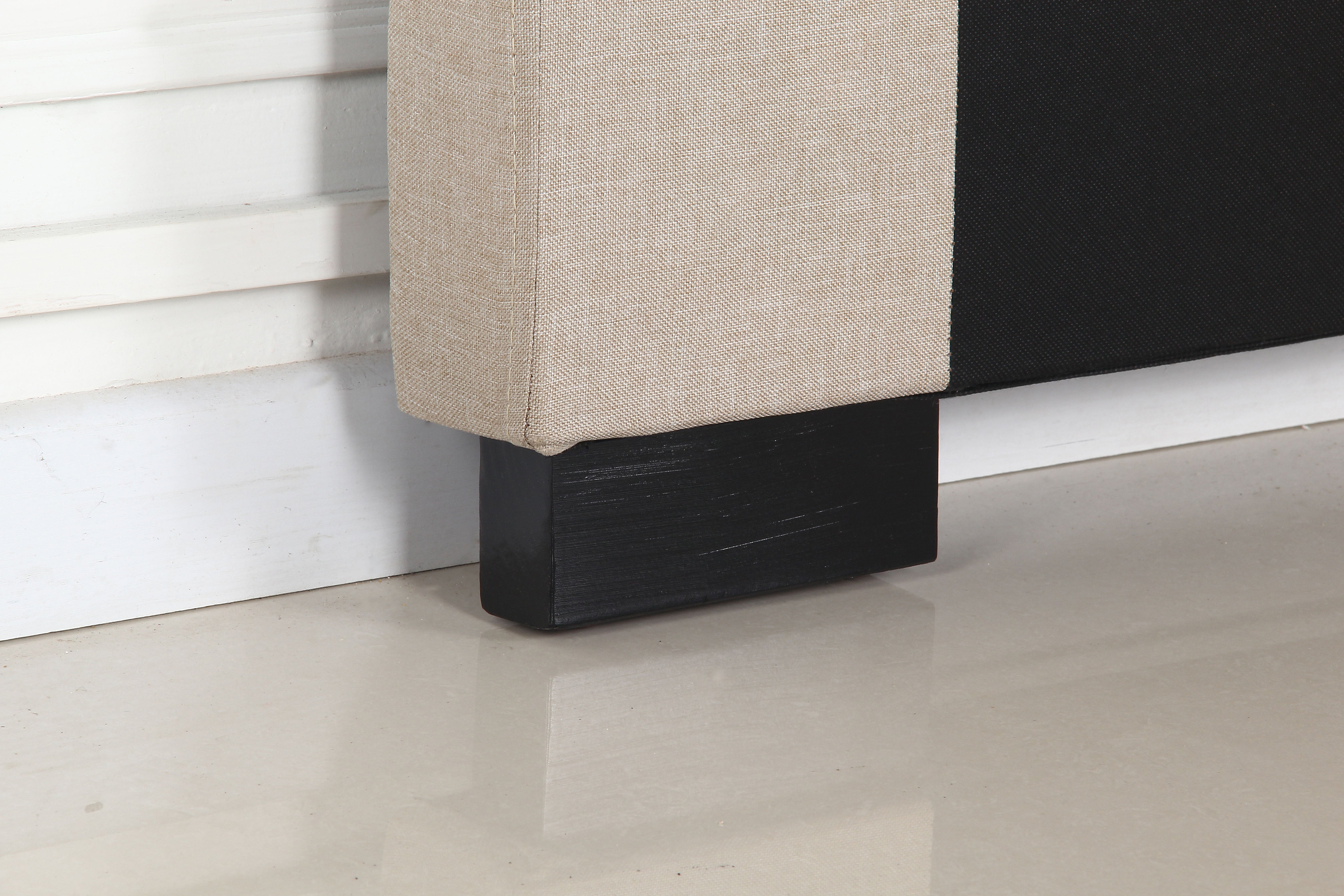 Beige headboard corner with dark base block and clean straight edge