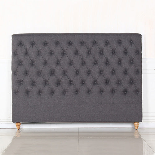Charcoal fabric upholstered headboard with tufted diamond buttons and rounded top