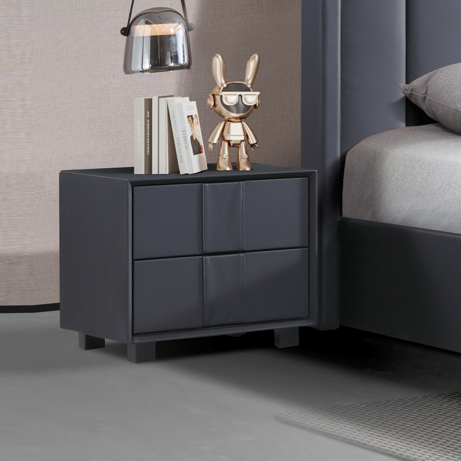 Dark fabric upholstered bedside table with four drawer fronts and iron feet