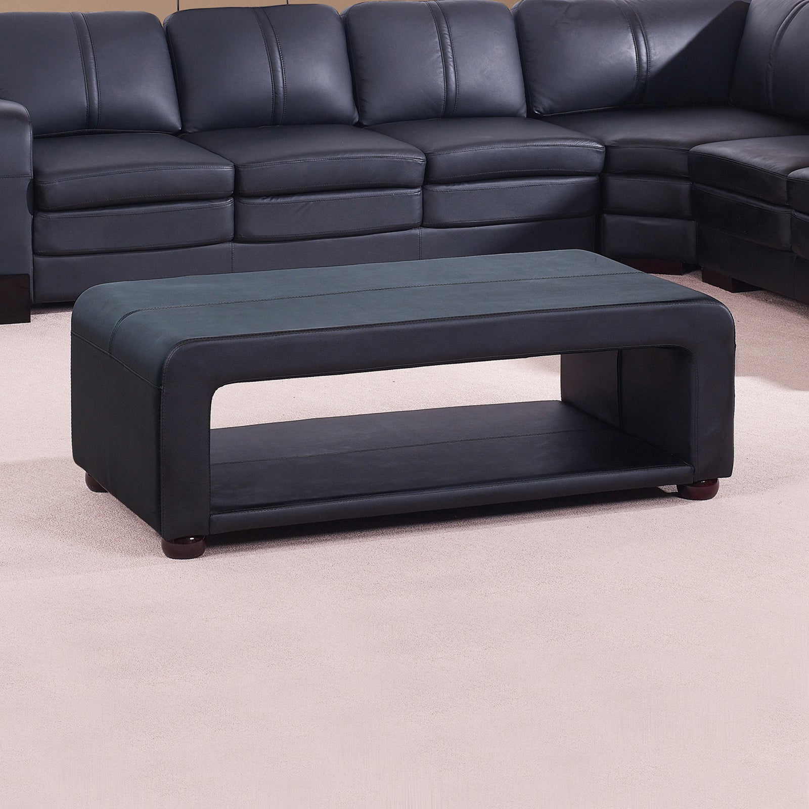 Black PU leather coffee table with open storage, cushioned top and side panels