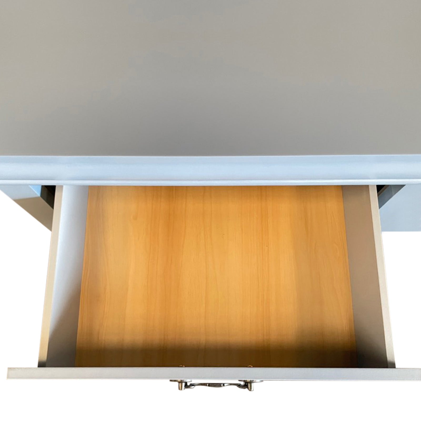 White dresser with top open, showing wooden interior storage space