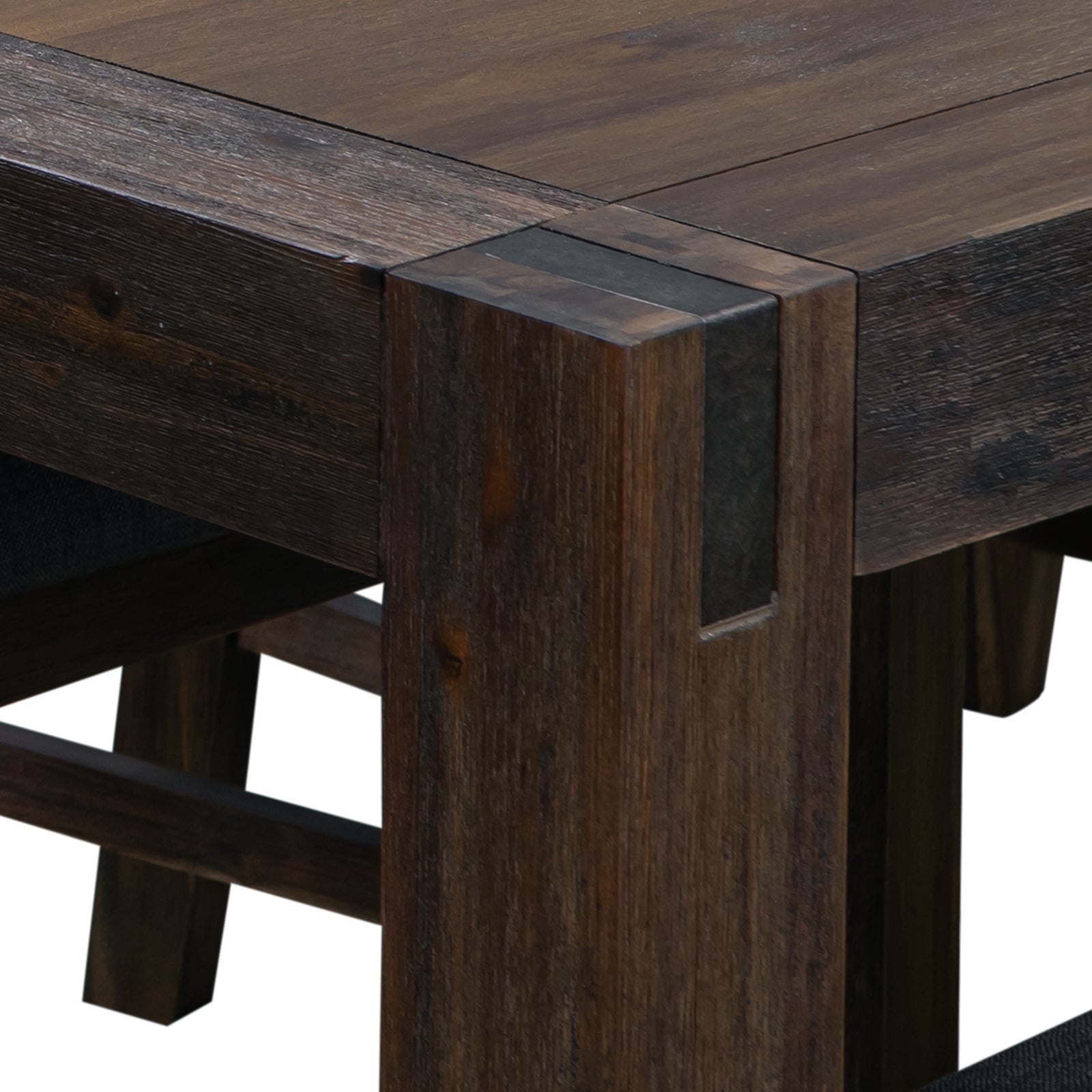 Close-up of dark wood dining table corner, showing leg and tabletop detail