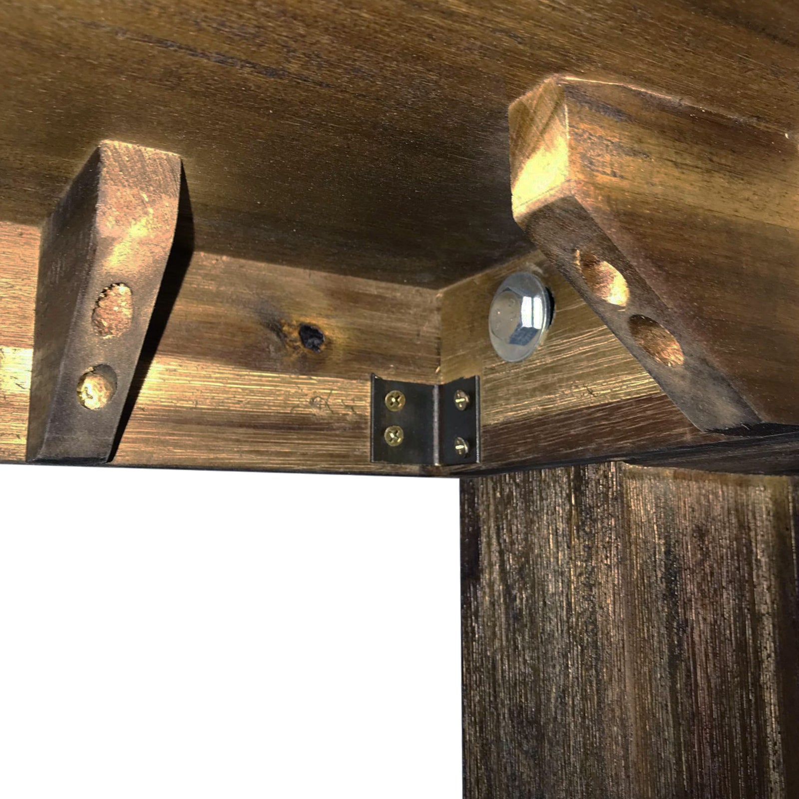 Underside metal bracket plates on a dark wood dining table frame corner