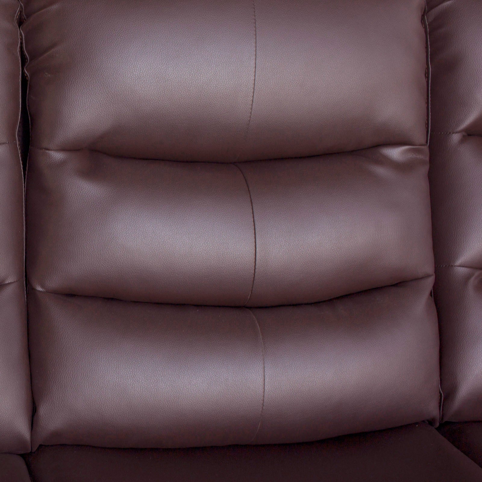 Brown faux leather recliner back panel detail with stitched cushions and vertical seams.
