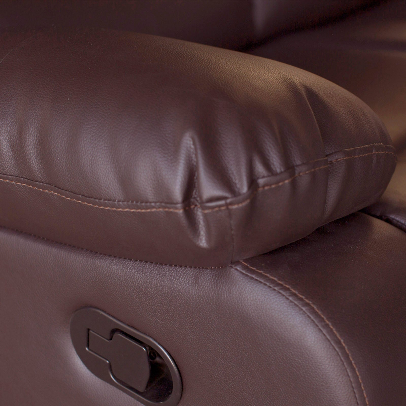 Brown faux leather recliner armrest end with pull handle control and stitched seam.