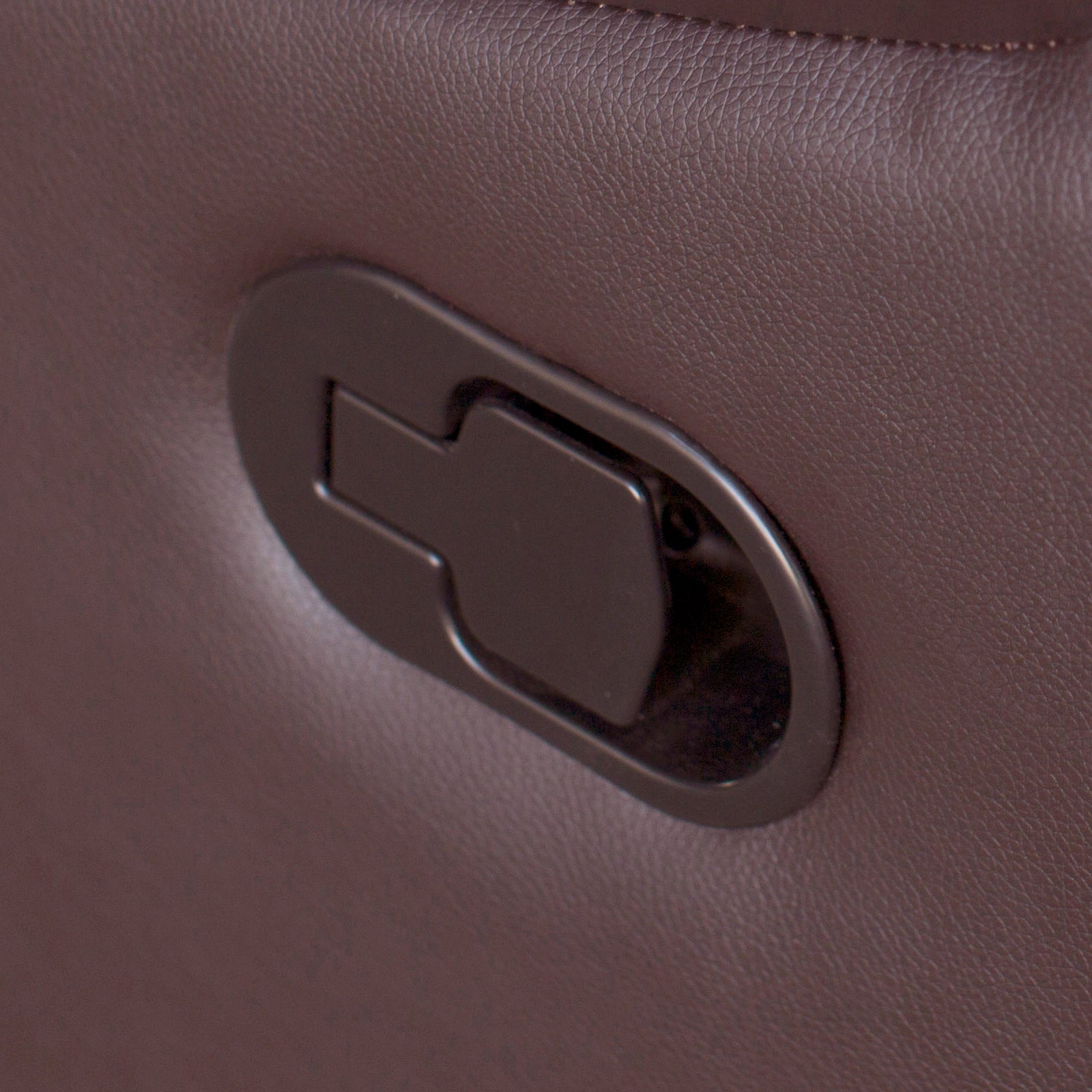 Brown faux leather recliner pull handle control inset in armrest panel.