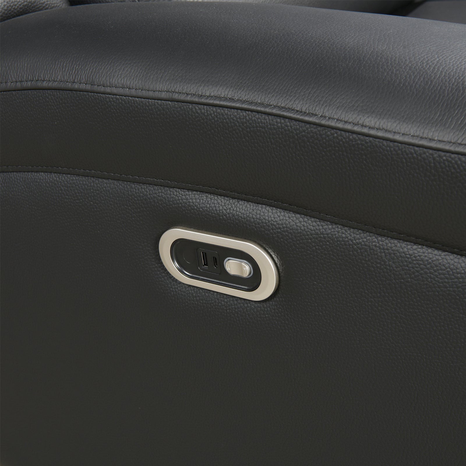Black recliner side panel with recessed control switch and button