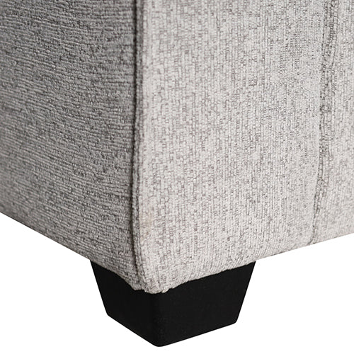 Sofa base corner with black feet and textured light gray fabric upholstery