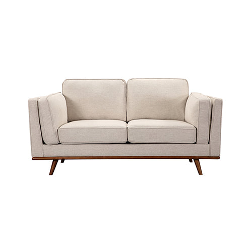 Beige 3-seat sofa with boxy back cushions and wooden legs