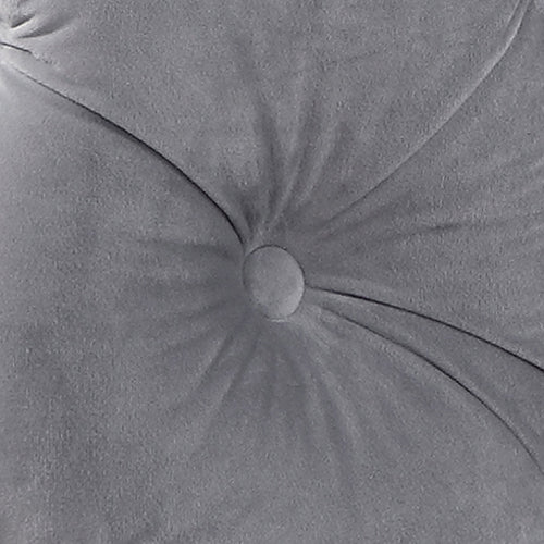 Grey velvet button-tufted upholstery close-up with round tuft buttons
