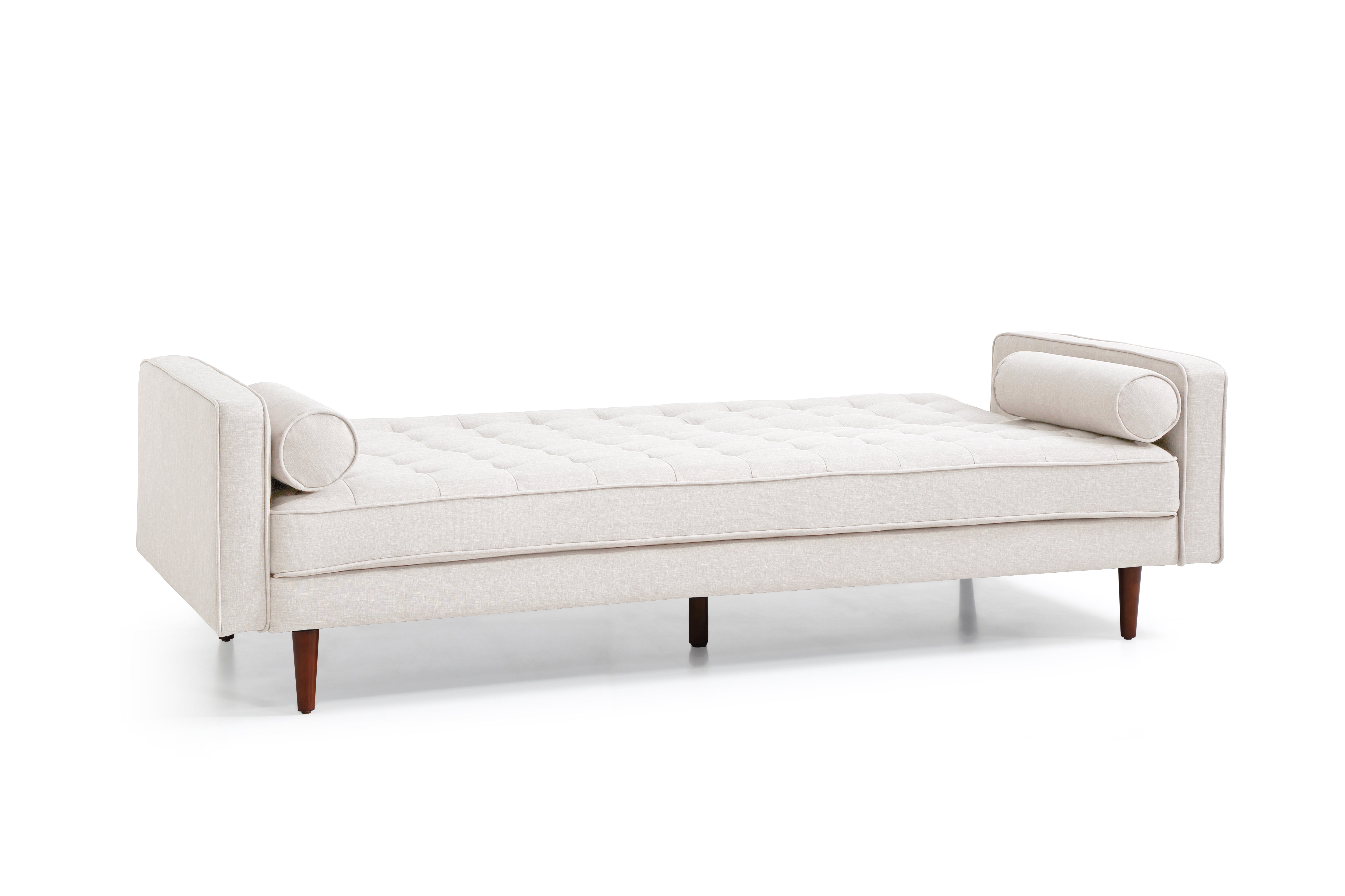 Beige sofa bed with two arm bolsters, button-tufted seat, and exposed legs