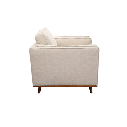 Beige fabric armchair with square arms, cushioned back, and wooden feet