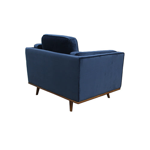 Single-seater armchair with dark blue velvet seat, back cushion, and wooden legs