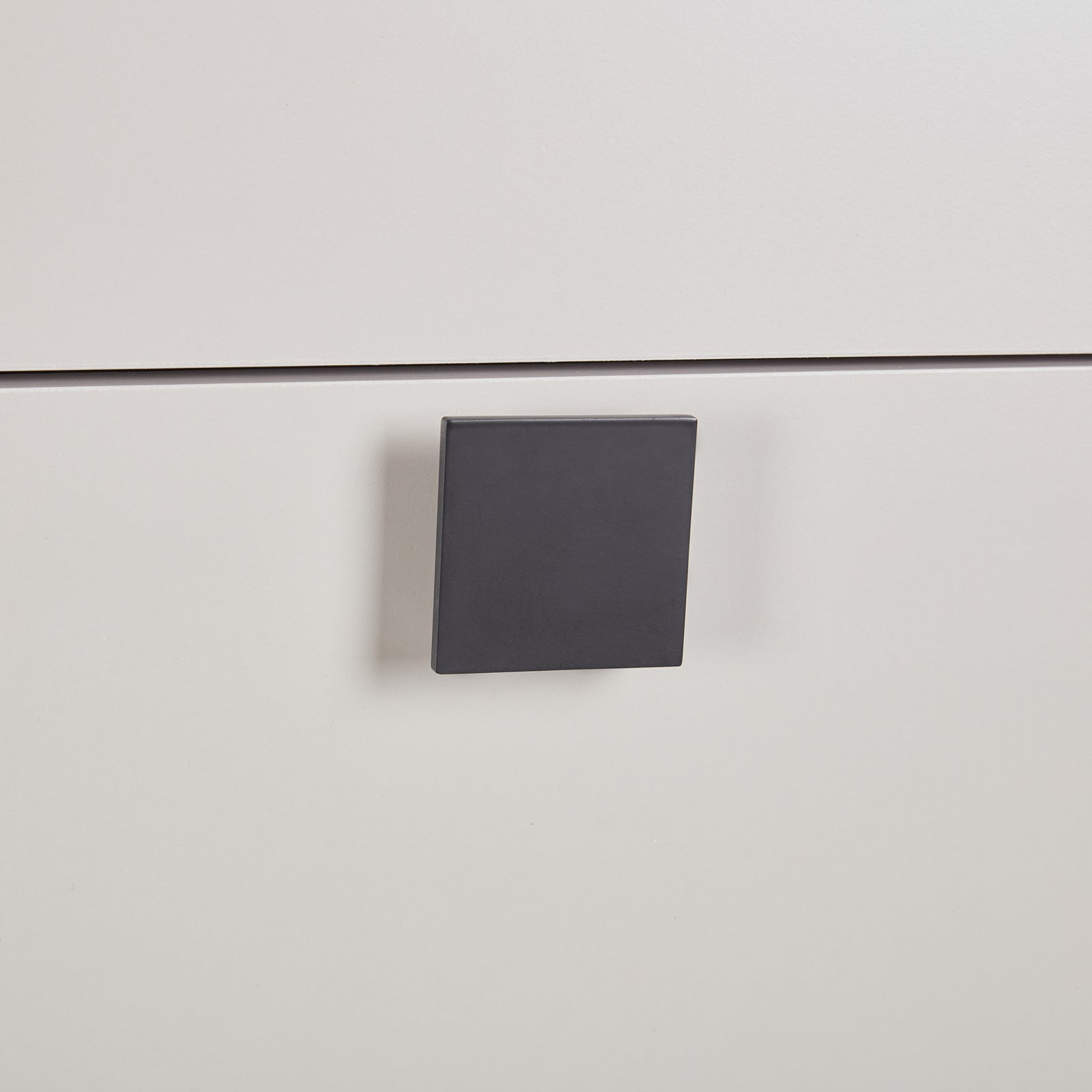 Tallboy drawer pull, square black hardware on light champagne MDF front