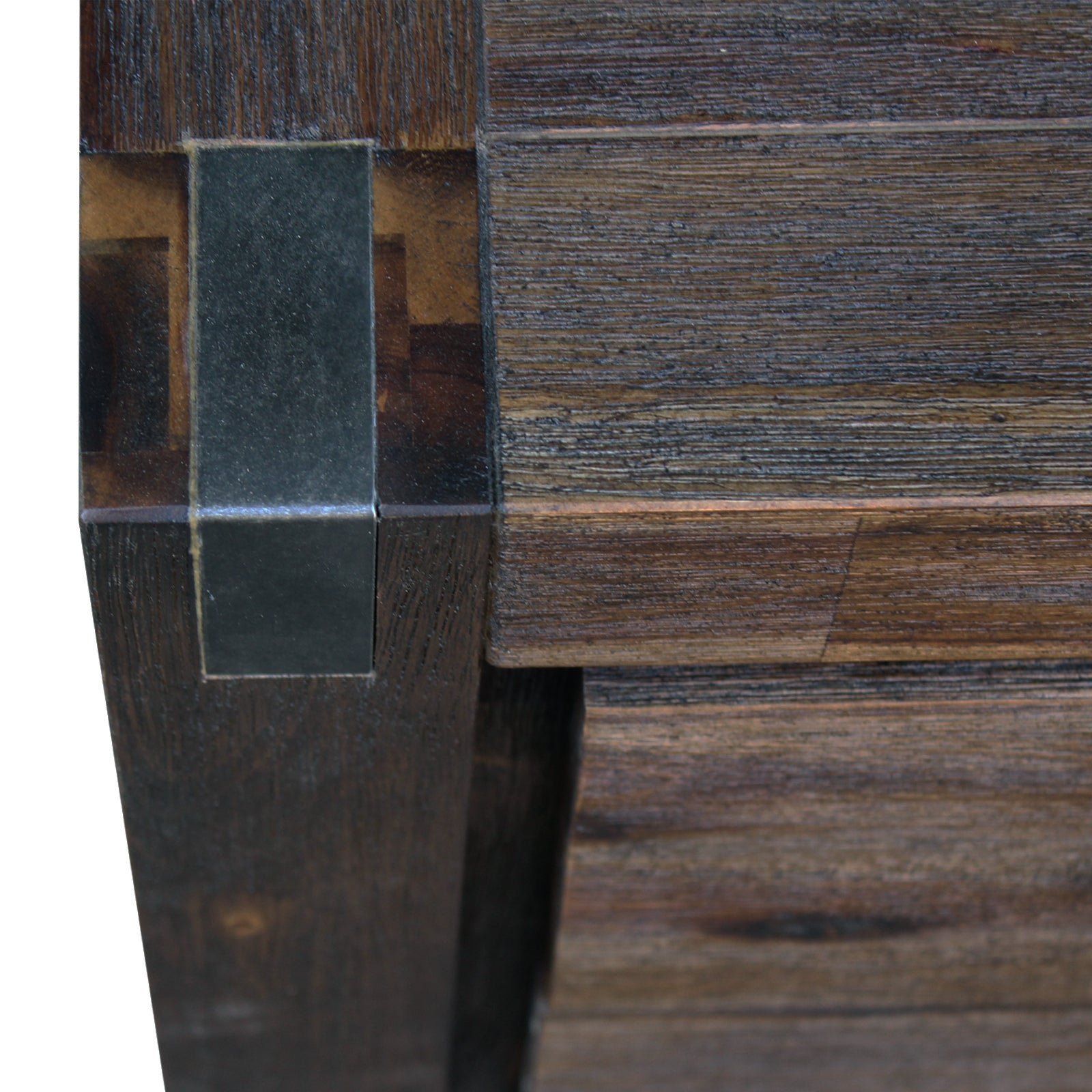 Close-up corner of a dark brown wooden tallboy with metal bar handle