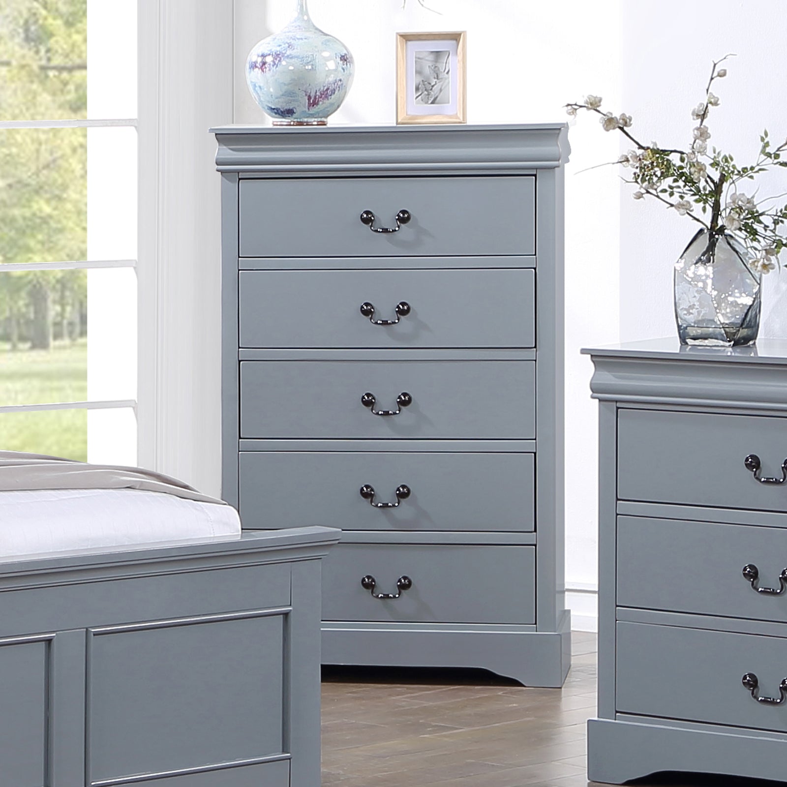 Grey wooden tallboy dresser with five drawers and metal cup handles
