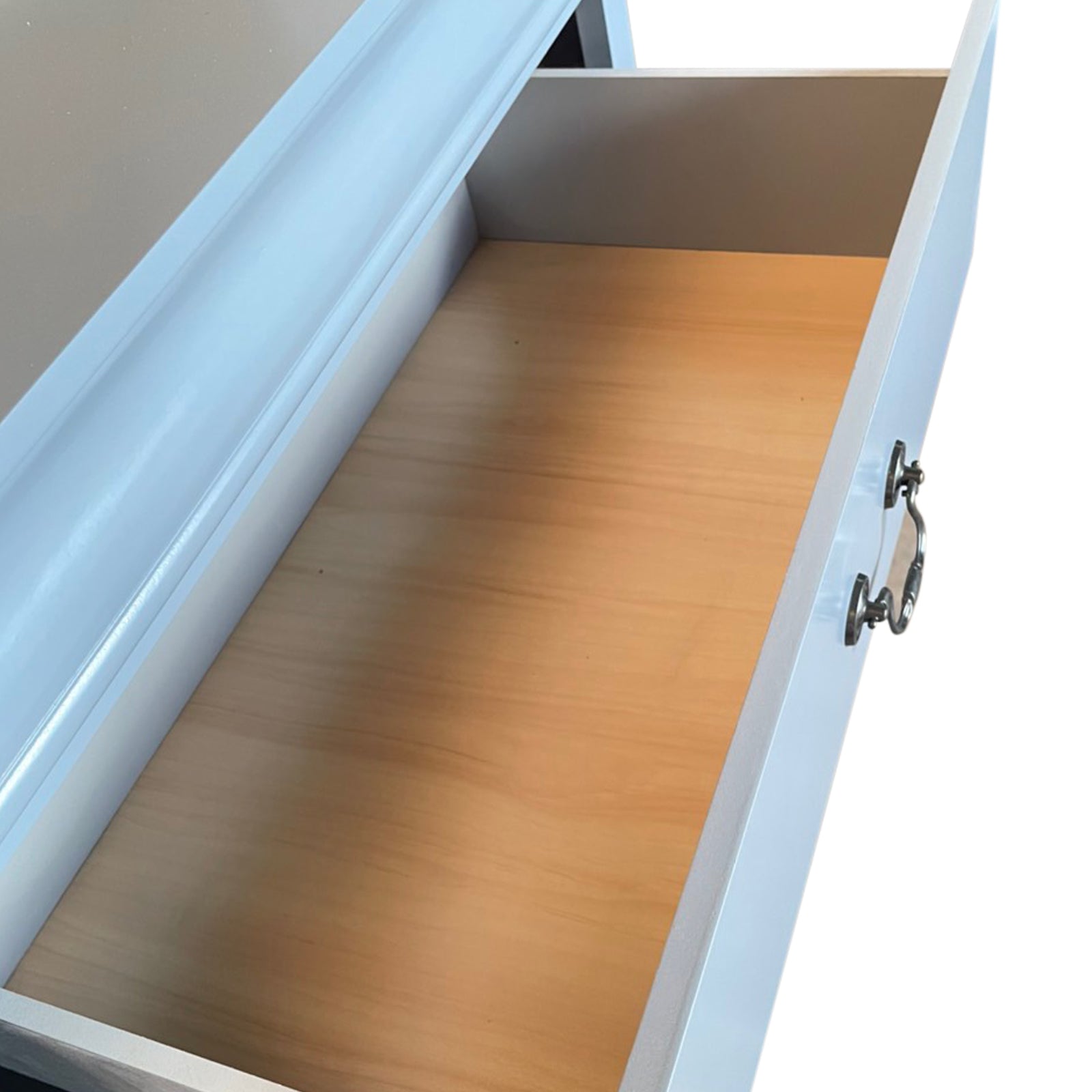 Blue-grey tallboy drawer interior with smooth wooden base and drawer runners