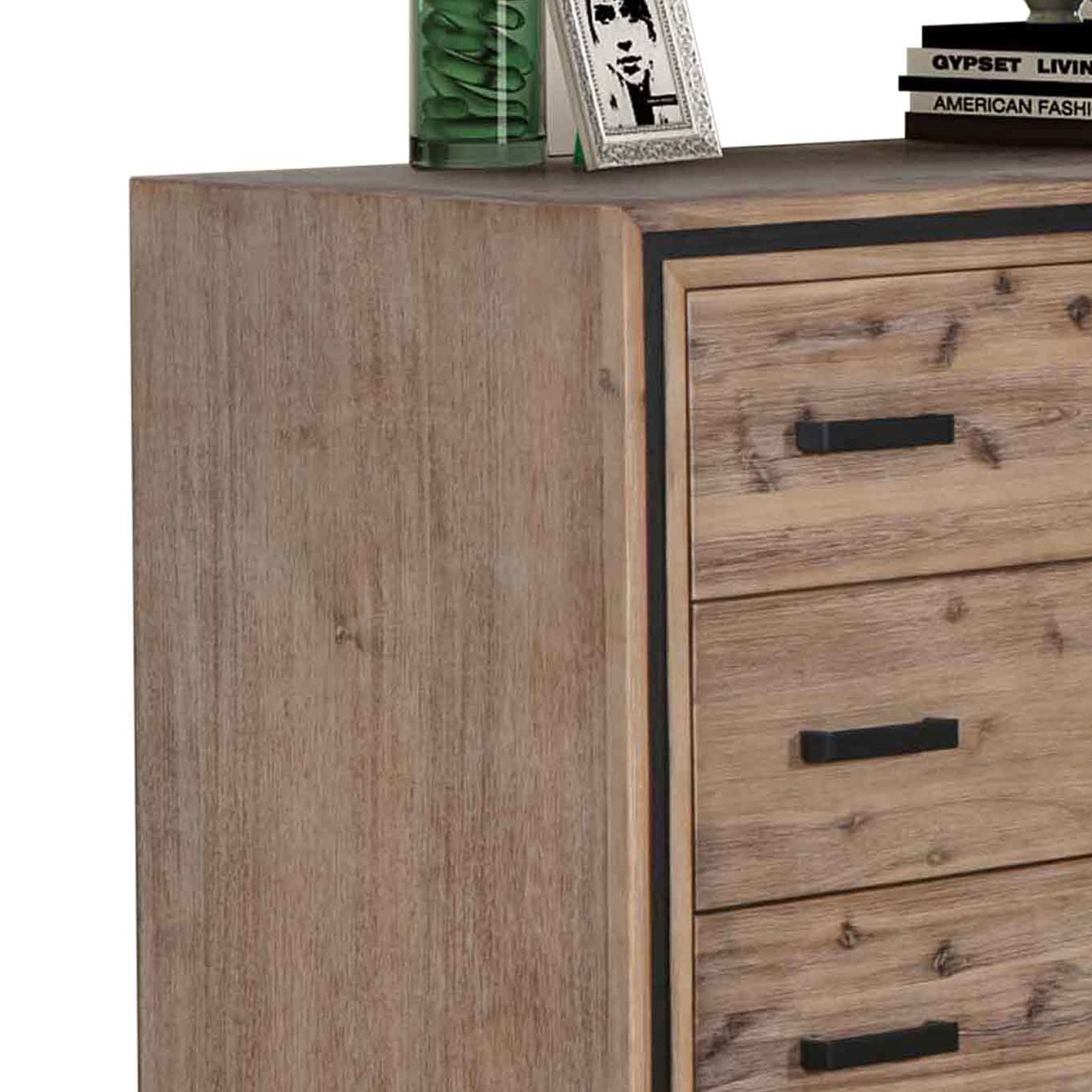 Tallboy cabinet corner with silver-brush frame and black drawer pull handles