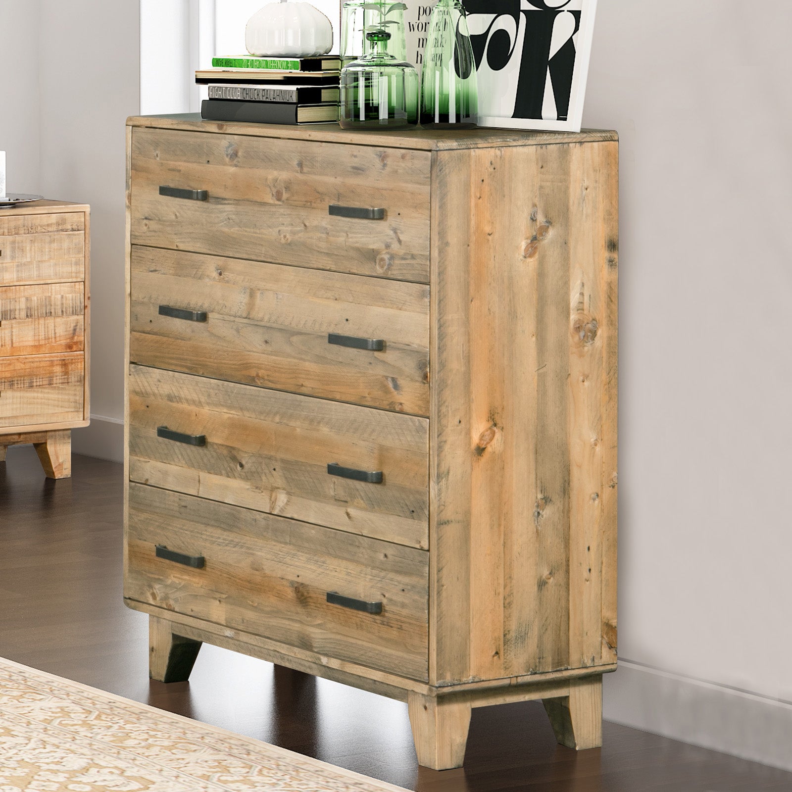 Light brown wooden tallboy cabinet with four drawers and black bar handles