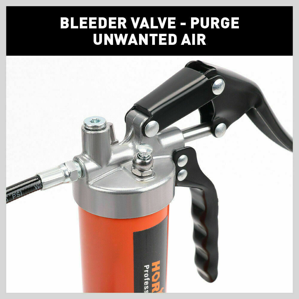 Grease gun with purge valve on metal head and black lever handle