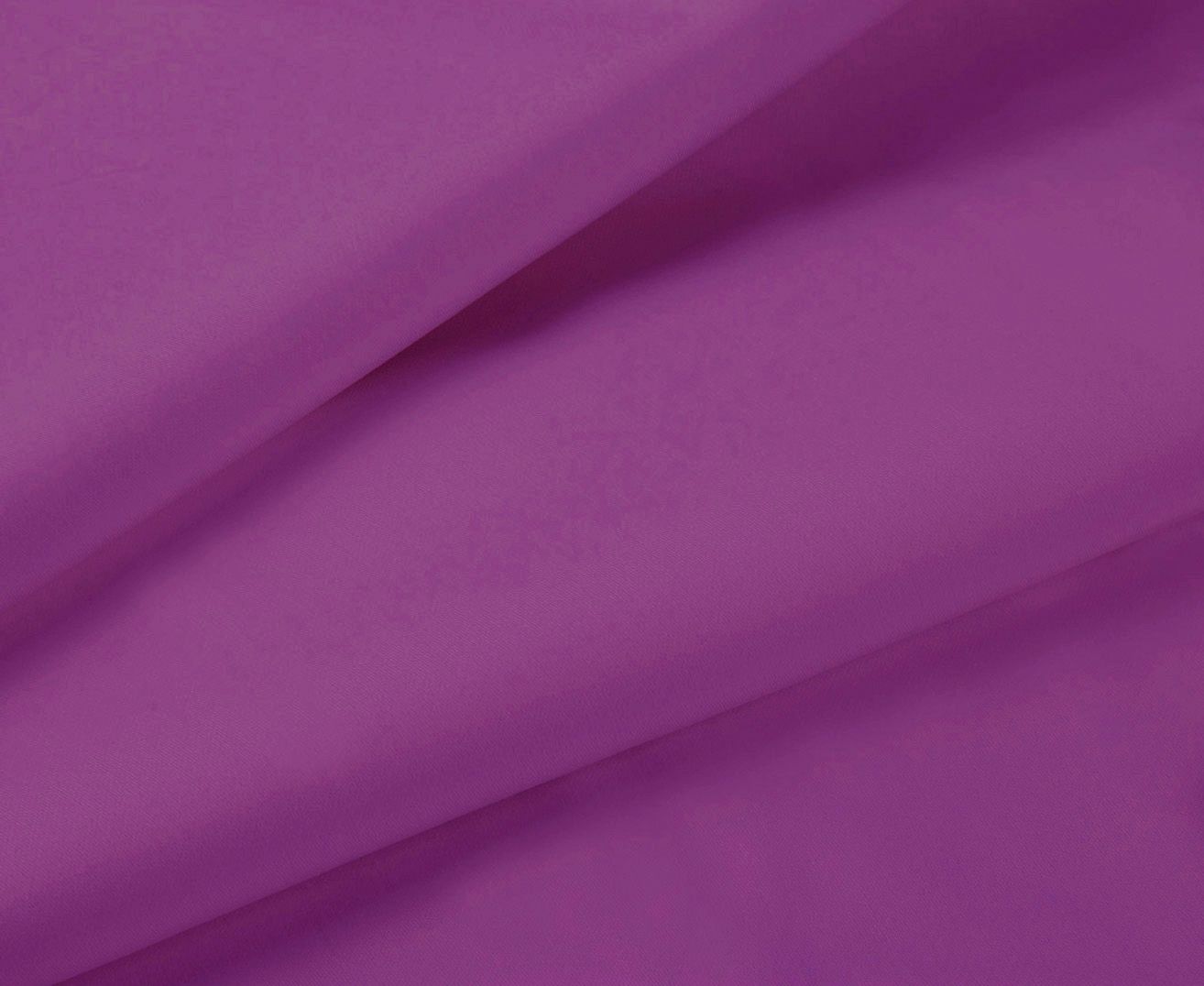 Purple fitted sheet fabric close-up with smooth folds
