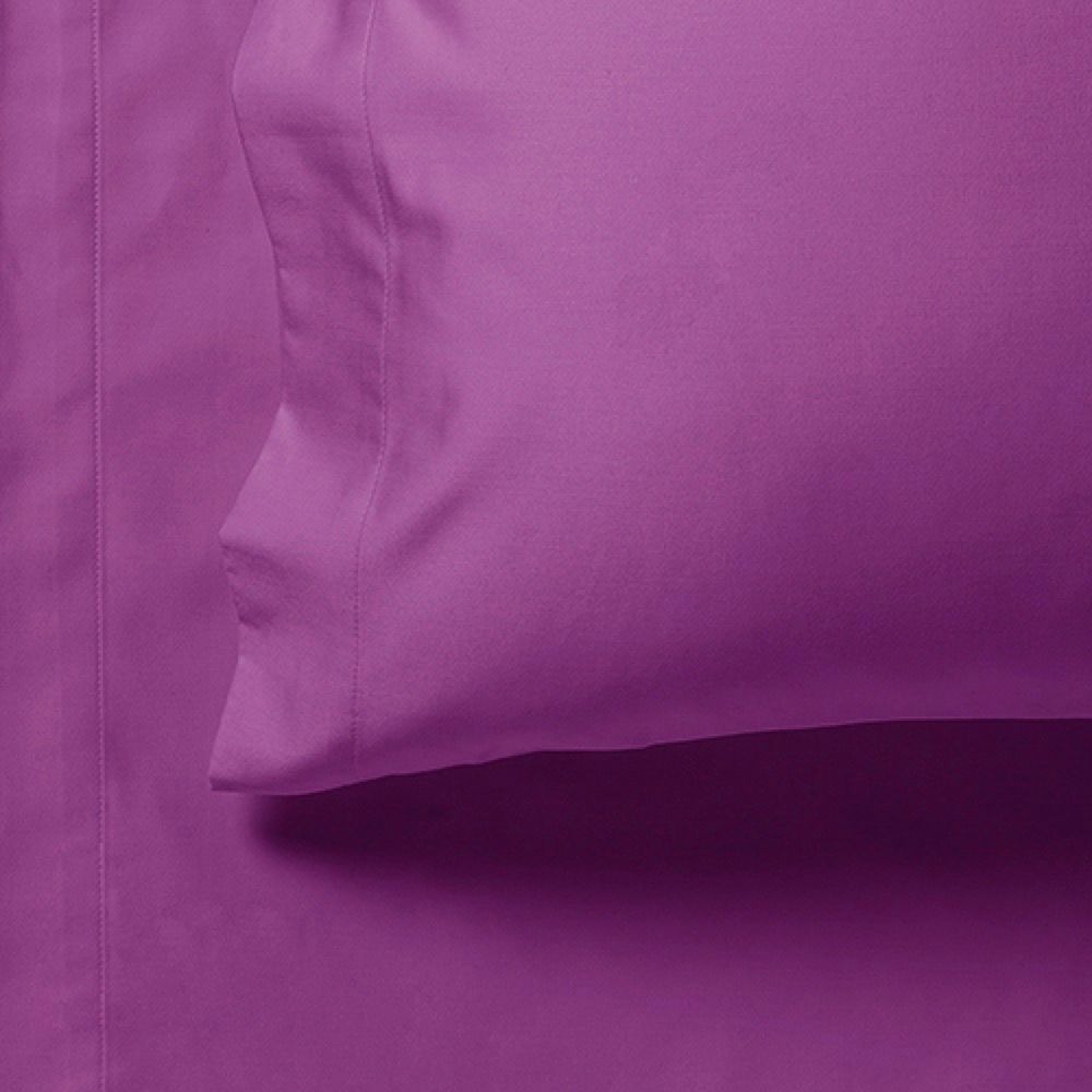 Purple fitted sheet side seam and stitched edge with gathered fold