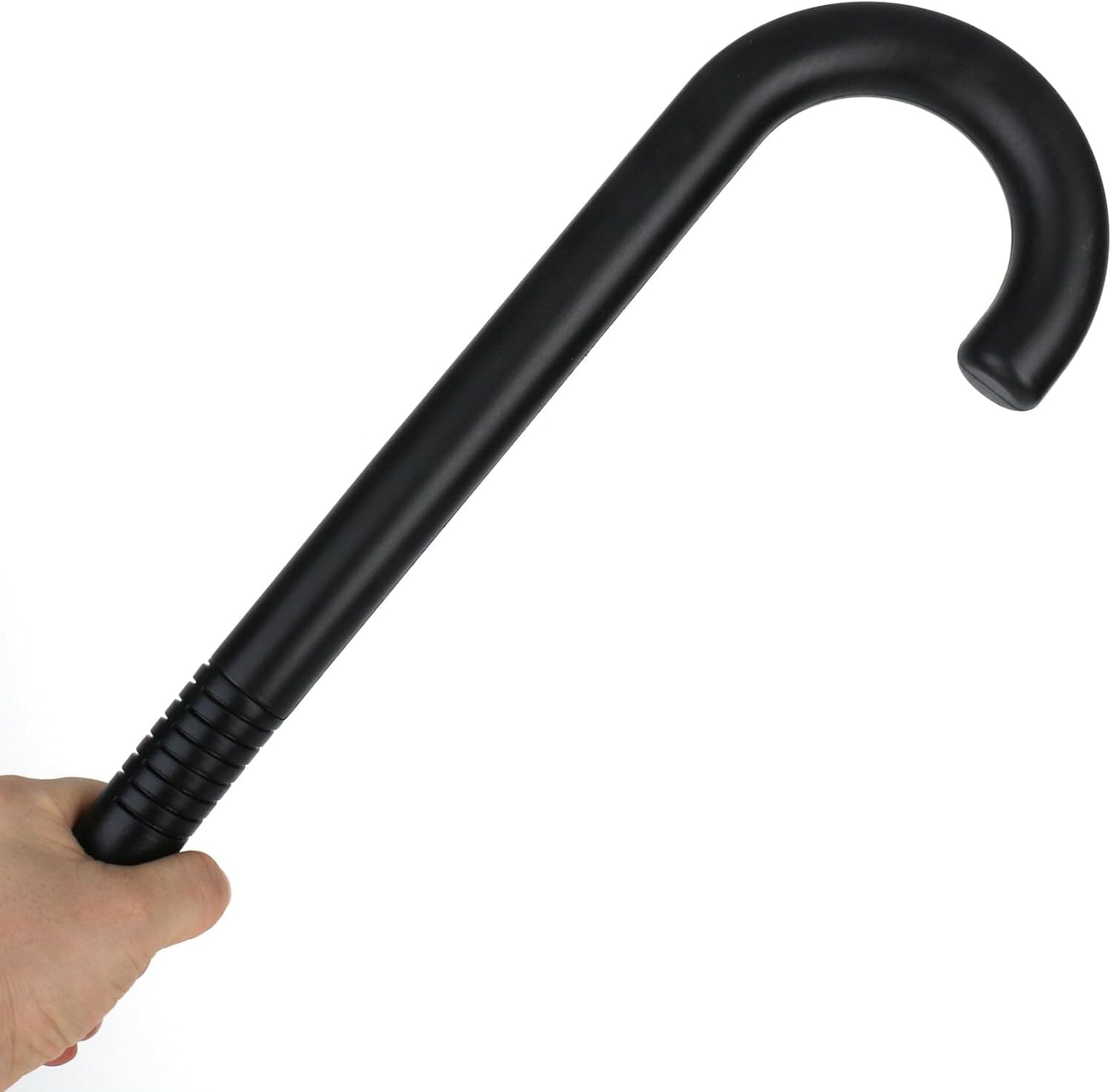 Black plastic walking cane held by hand, curved handle and ribbed base