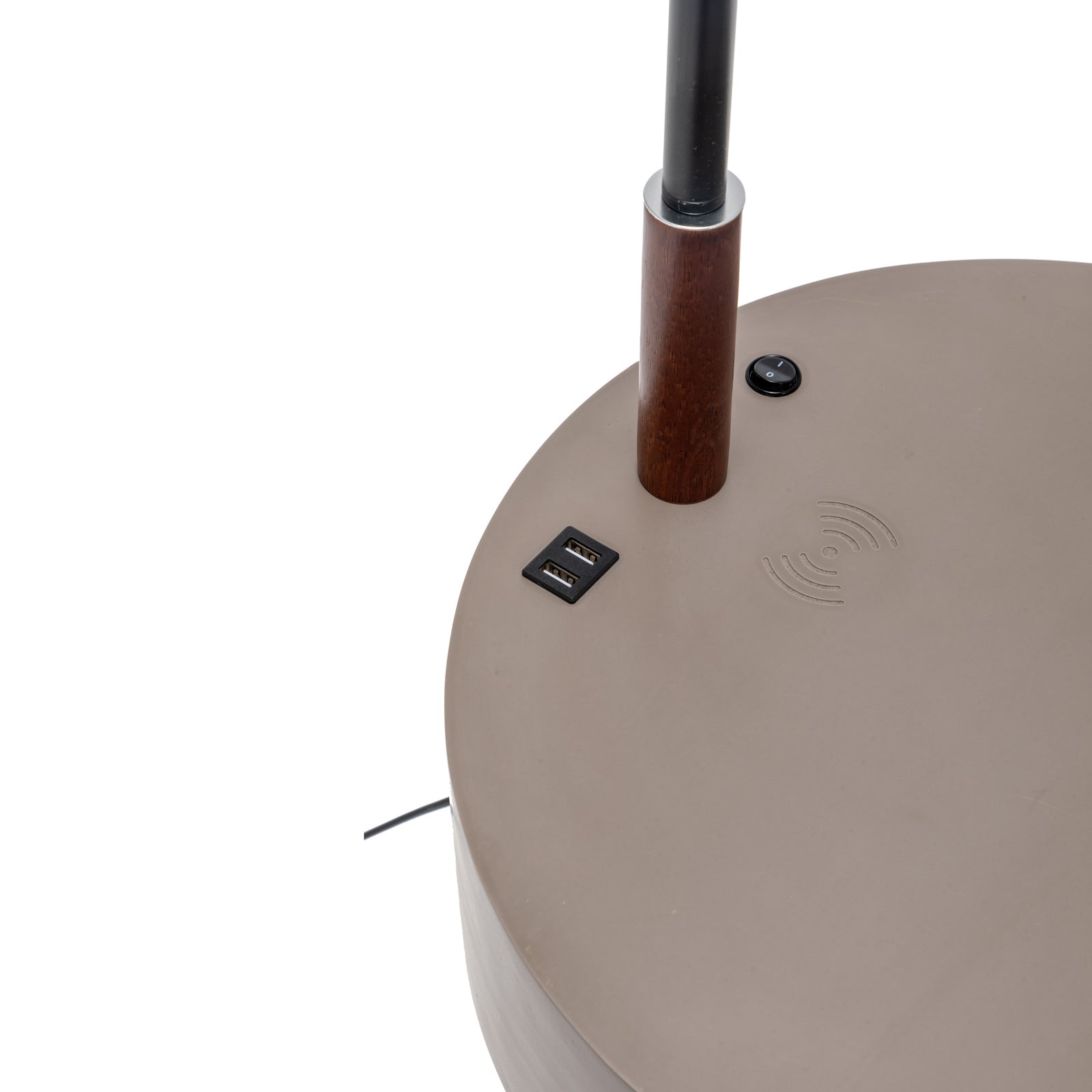 Lamp charging panel on round tabletop with USB ports and wireless icon