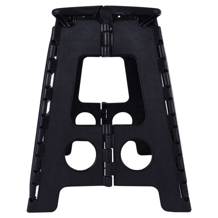 Black folding plastic step stool with textured panels and front cutout handholds