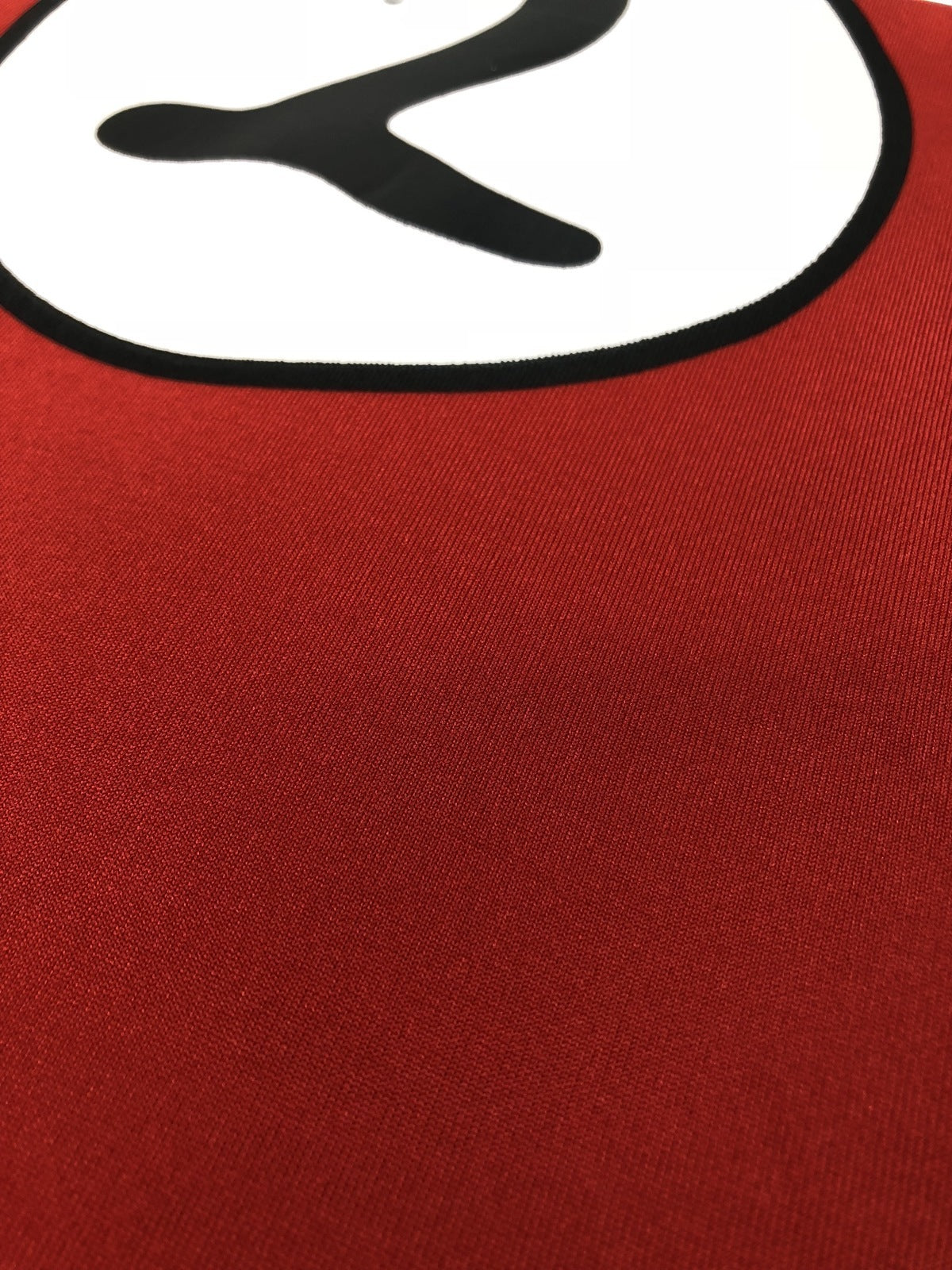 Red knit costume fabric close-up with black printed graphic outline