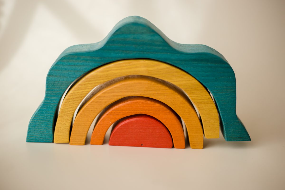 Wooden arch block set with teal top and stacked rainbow arches