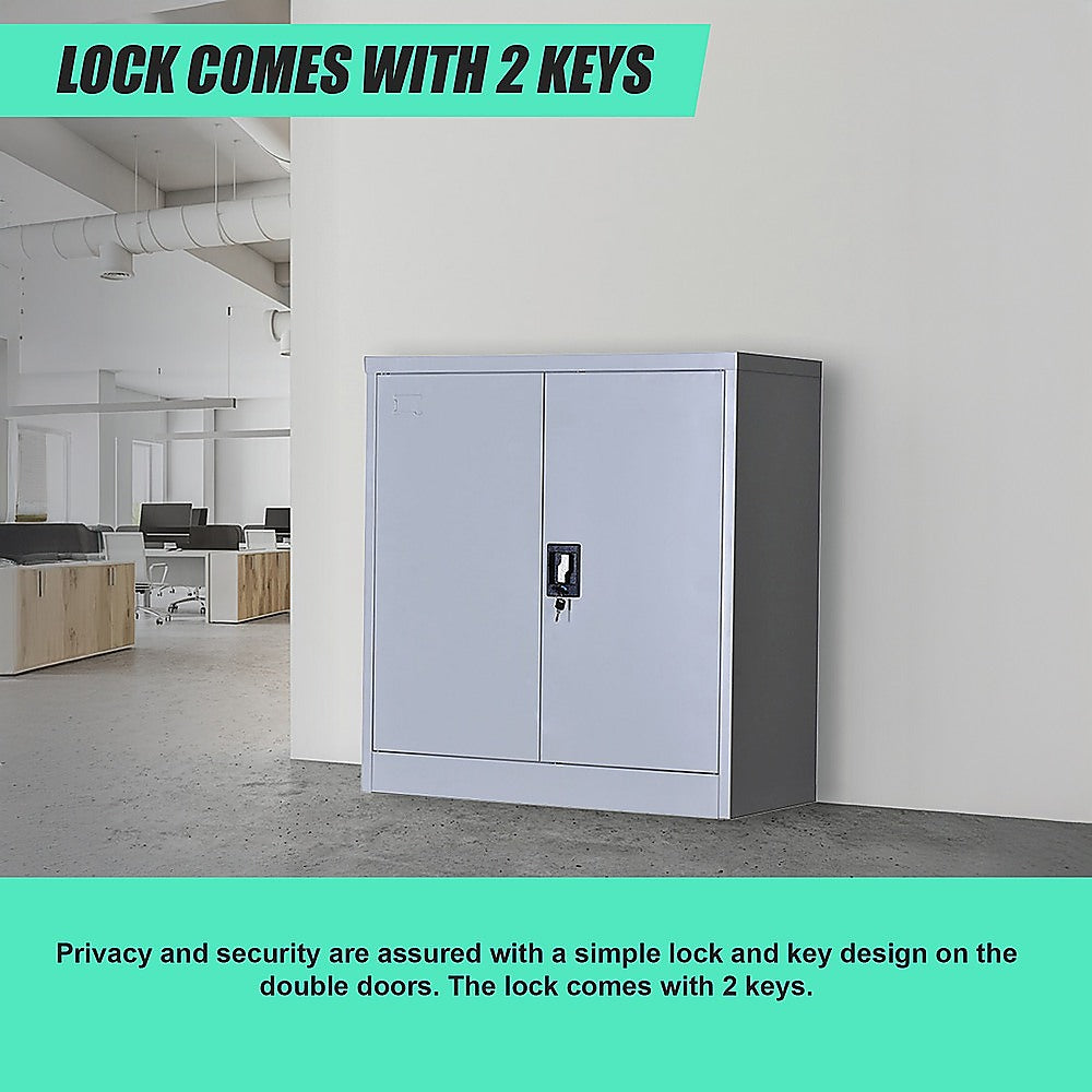 Two-door lockable storage cabinet with key lock and two keys shown in close view.