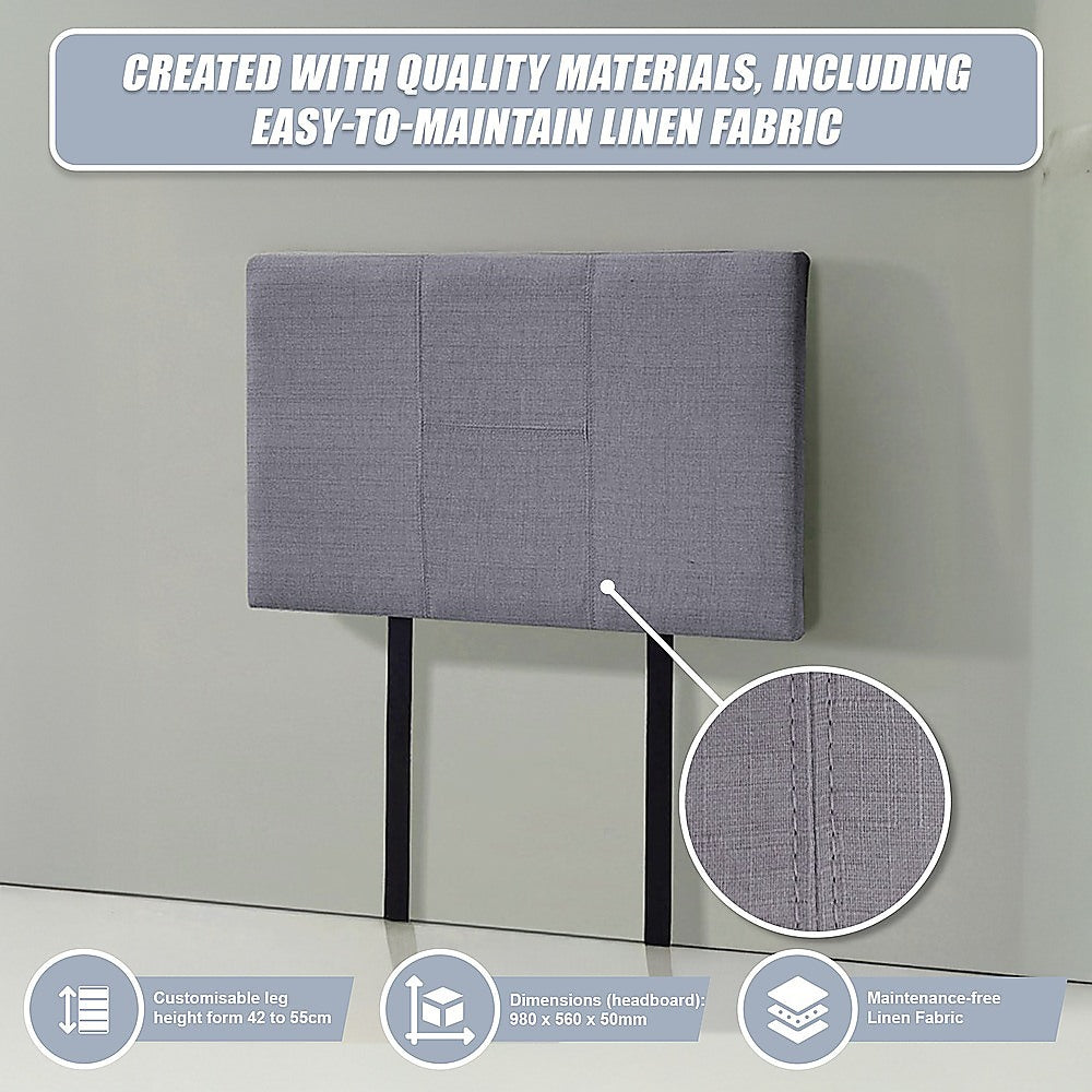 Grey linen headboard with stitched padded panels, textured fabric weave and black legs