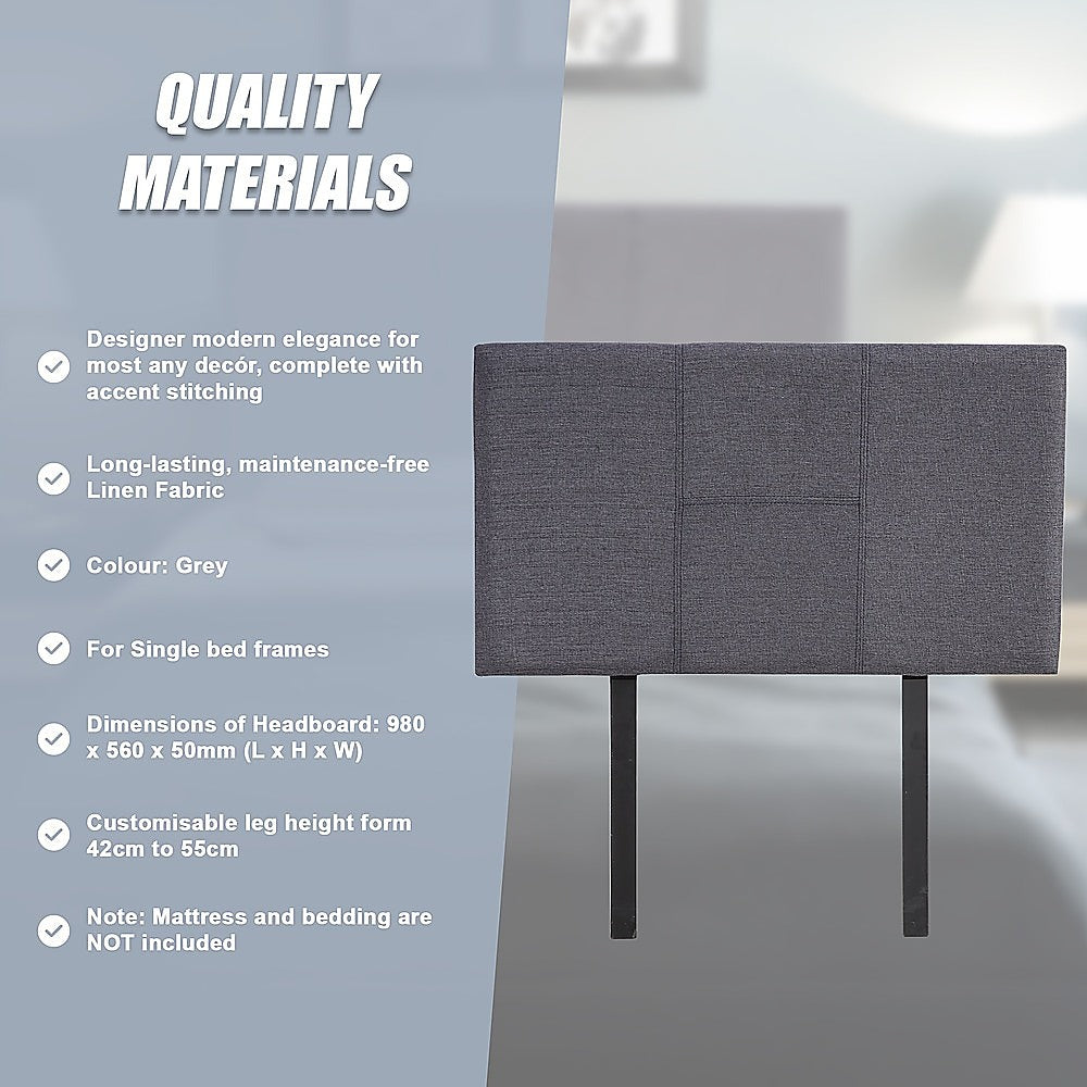 Grey linen headboard with padded panels and two dark legs, front view.