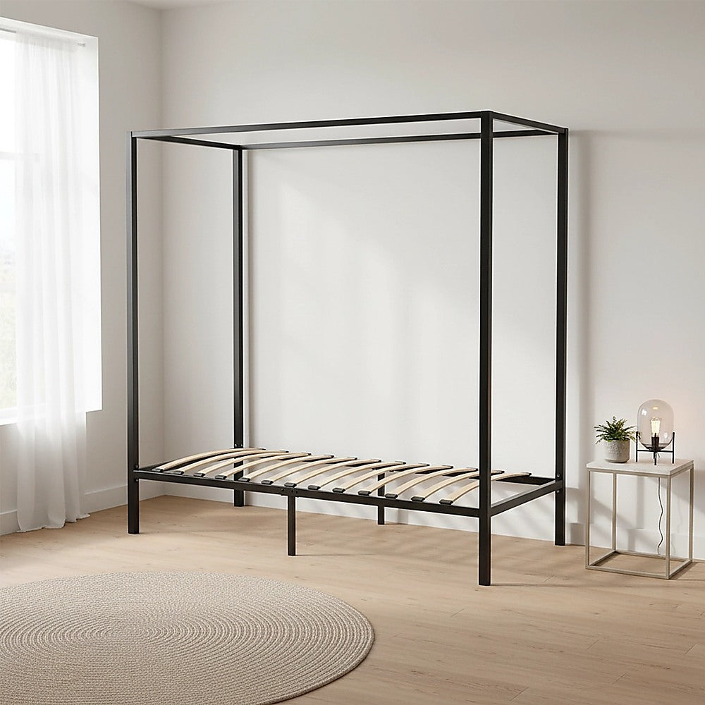 Black four-poster single bed frame with slatted base and open rectangular frame.